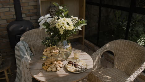 cozy patio snack table with flowers and treats