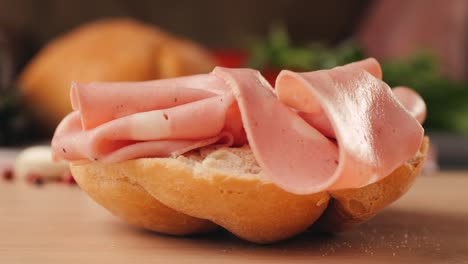preparing a salami sandwich
