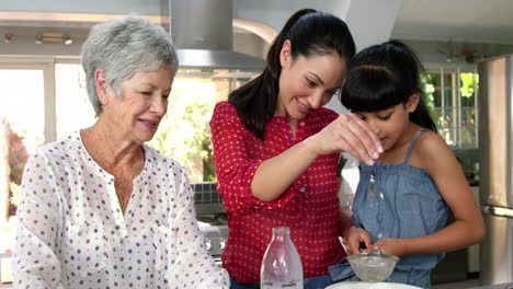 cute family preparing a cake