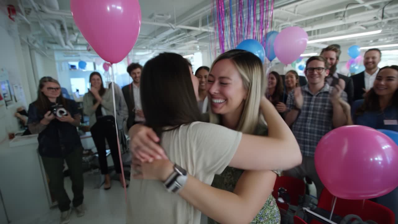 Celebrating Joyful Moments: Two Friends Share a Heartfelt Embrace in a Colorful Gathering with Balloons and Smiles, Surrounded by Supportive Friends and Colleagues