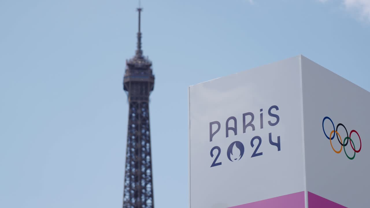 Paris 2024 Olympics sign with the Eiffel Tower in the background