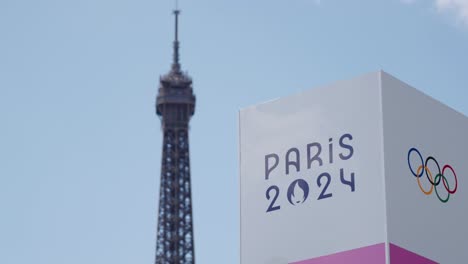 paris 2024 olympics sign with the eiffel tower in the background