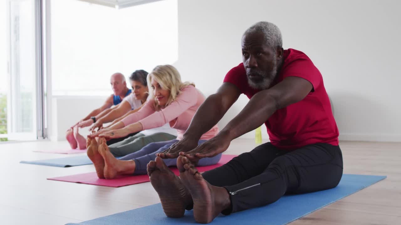 Diverse group of seniors taking part in fitness class