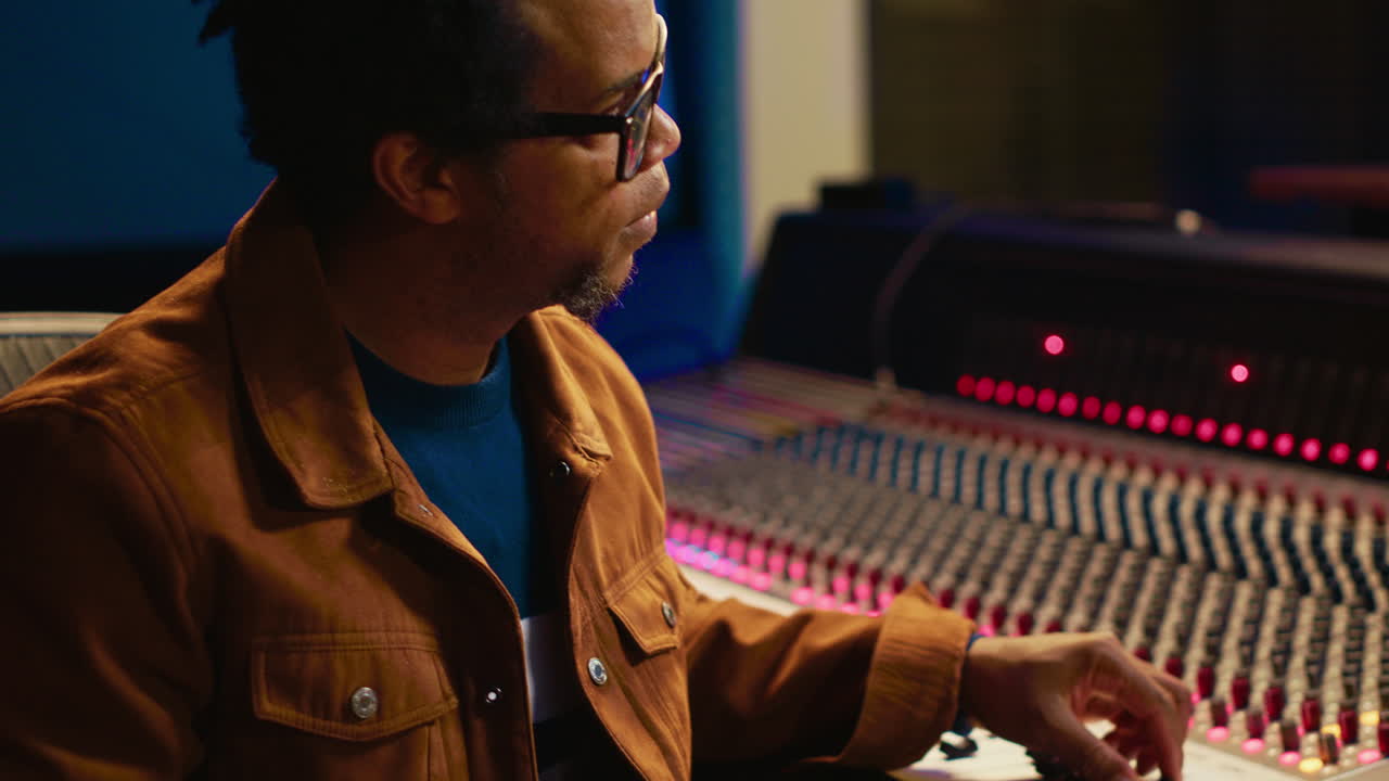 Professional artist singing a song on electro acoustic guitar in studio