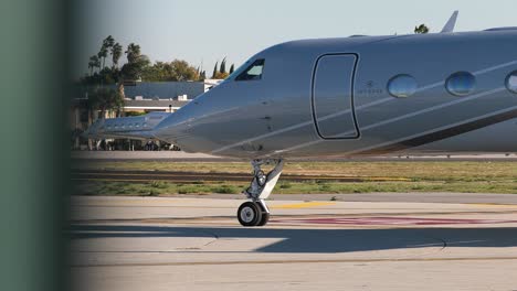 private plane taxiing by runway