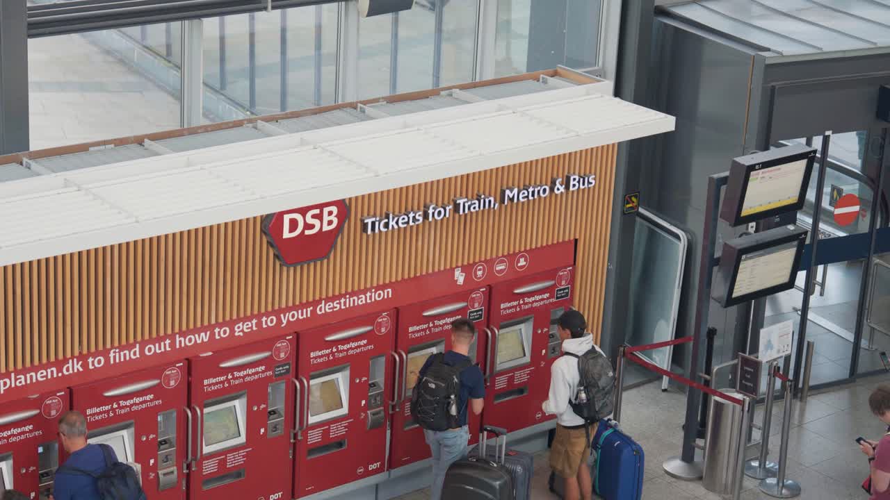People buy tickets for public transportation service in Copenhagen city