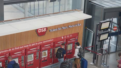 people buy tickets for public transportation service in copenhagen city