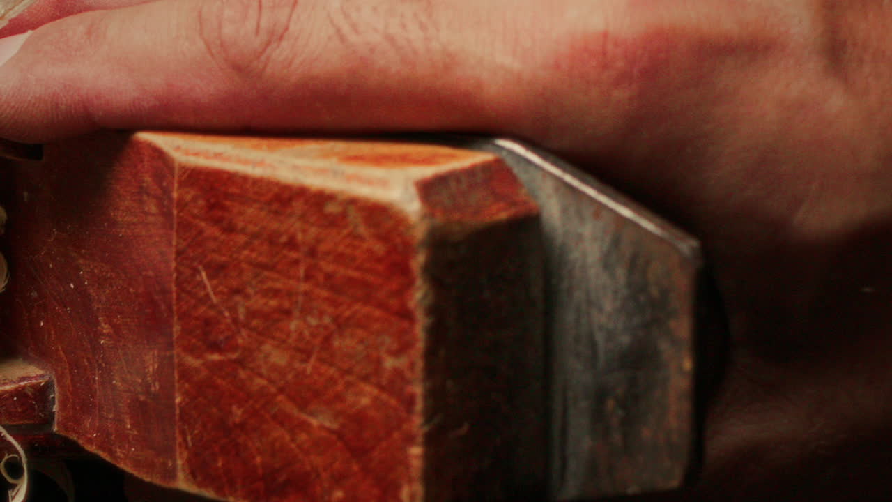 Close Up of Polishing Wooden Plank with Handheld Planer
