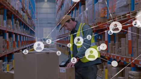 animation of networks of connection with people icons over caucasian man working in warehouse