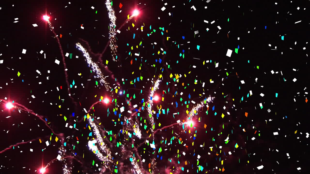 Animación de confeti y fuegos artificiales explotando sobre fondo negro