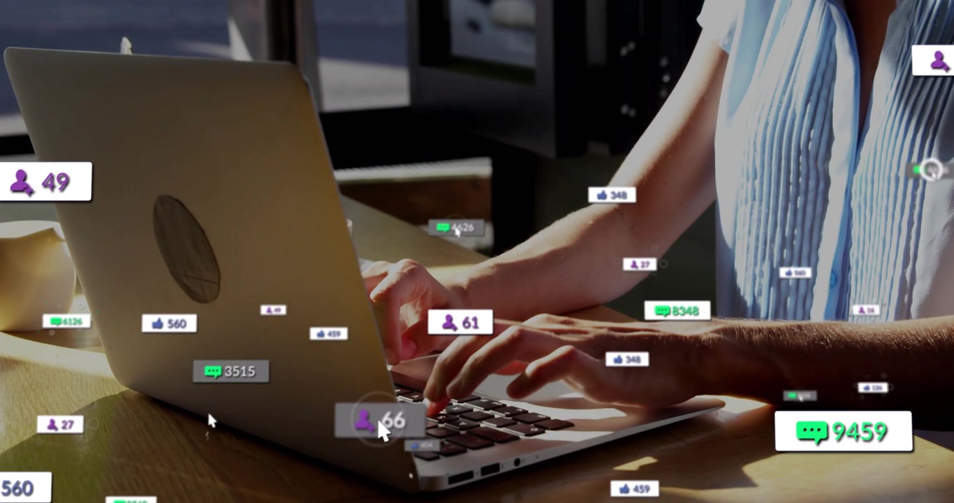 Hands typing on laptop causing social engagement climbing as creator monitoring growth and smiling