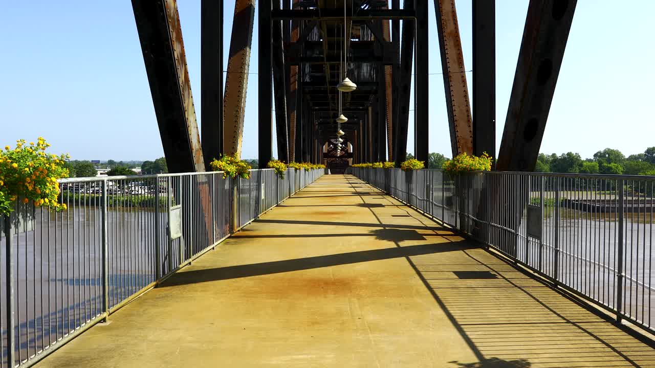 Static video of the Arkansas Park Trail bridge. Video is shot facing approximately north, looking down the pathway on the bridge