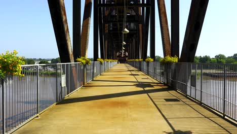 static video of the arkansas park trail bridge. video is shot facing approximately north, looking down the pathway on the bridge