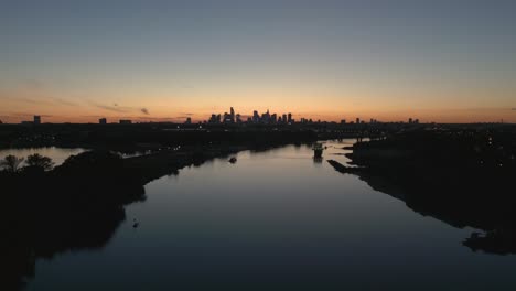 Peaceful-river-Vistula-with-the-background-of-Warsaw-skyscrapers-at-dawn