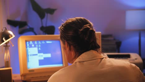 man working and gaming on retro computer pc, it engineer with vintage computer at home, using old fashion technology, close up of retro setup.