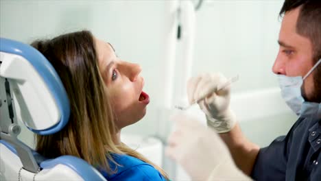 dentist examining patient's teeth