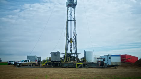 a high metal tower for drilling the oil and gas. low angle view on the equipment for production of natural resources.