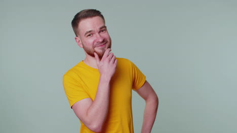 Cheerful-lovely-bearded-adult-man-fashion-model-in-casual-t-shirt-smiling-and-looking-at-camera