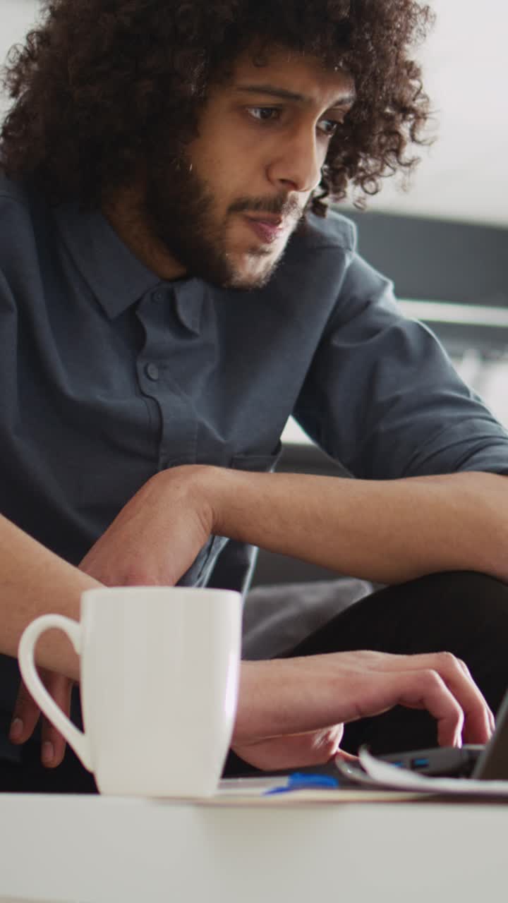 Vertical Video Startup specialist using laptop