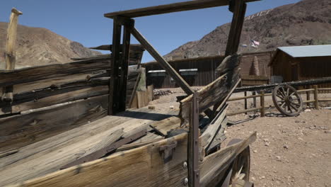 a rusted and derelict settlers wagon on display at calico ghost town, california