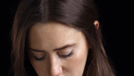 Studio-Shot-Of-Unhappy-Young-Woman-Crying-Into-Camera