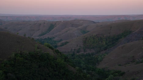 panoramic view of rolling hills and valleys at dusk
