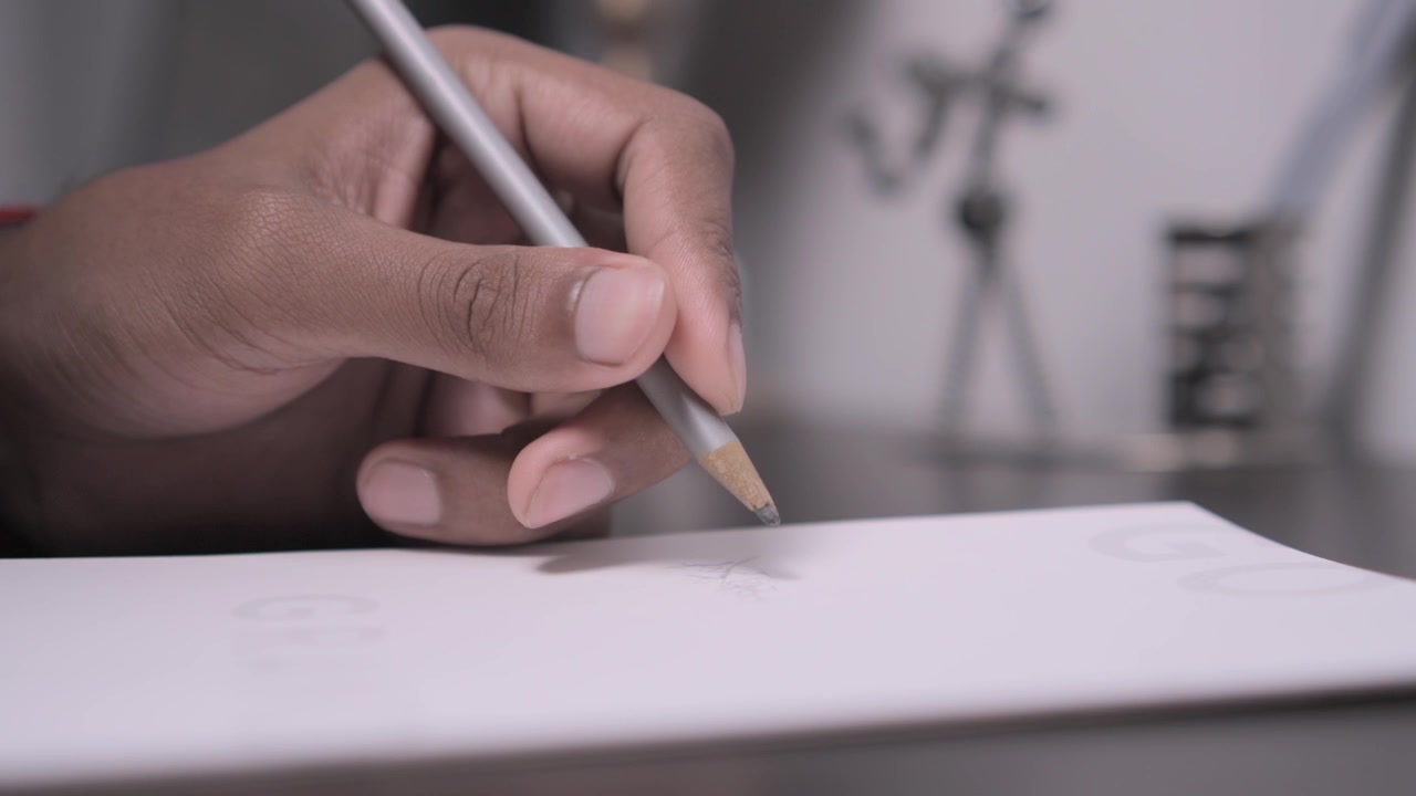 Close-Up of a Hand Writing on Paper