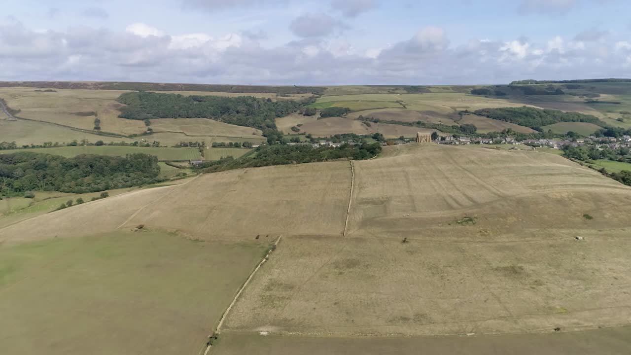 Aerial view of a rural landscape with hills and fields