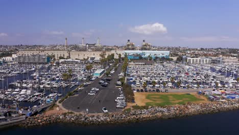 Low-aerial-dolly-shot-of-the-boat-landing-at-King-Harbor-Marina-in-Redondo-Beach,-California