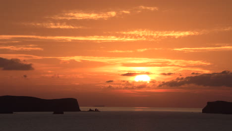 timelapse of how the sun goes behind the clouds in cala comte, ibiza, spain