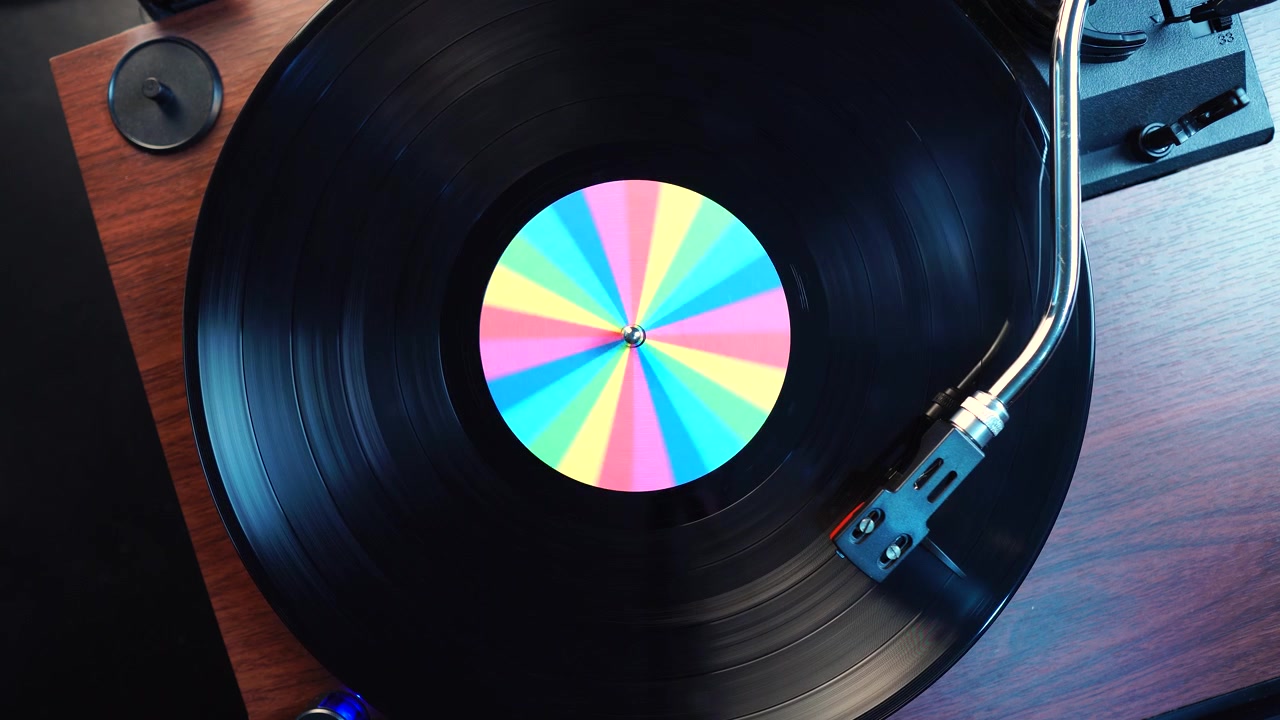Listening Playback of Long Play Vinyl Record With Rainbow Sticker, Top Down View