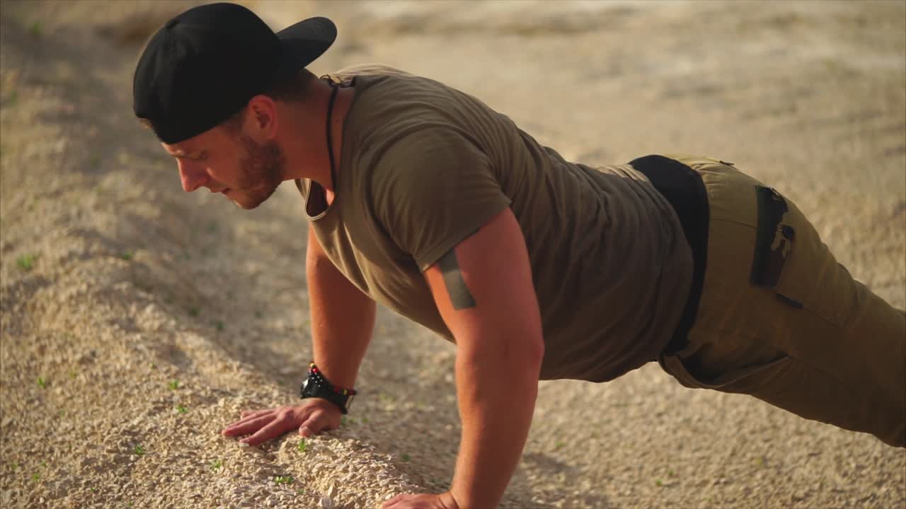 Man Doing Push-ups in the Desert