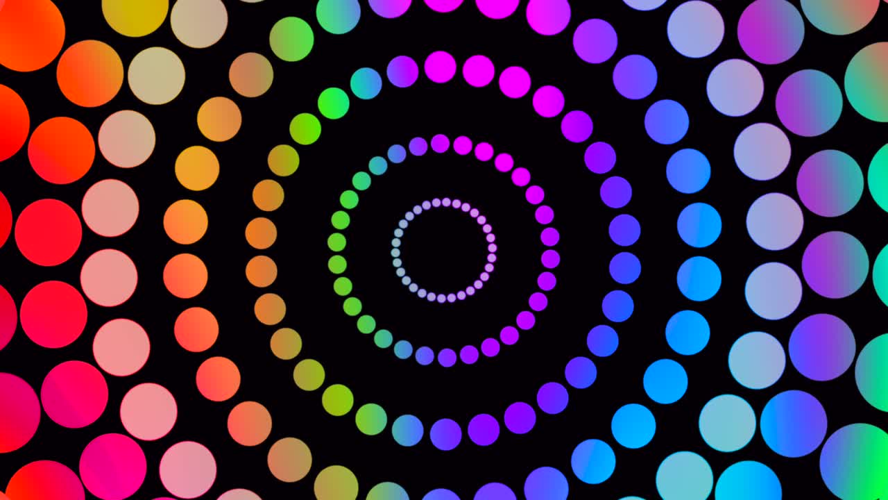 toma abstracta de puntos multicolores girando en círculo sobre fondo negro, animación