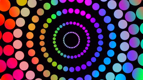 Abstract shot of mulitcolored points spinning in circle on black background,animation