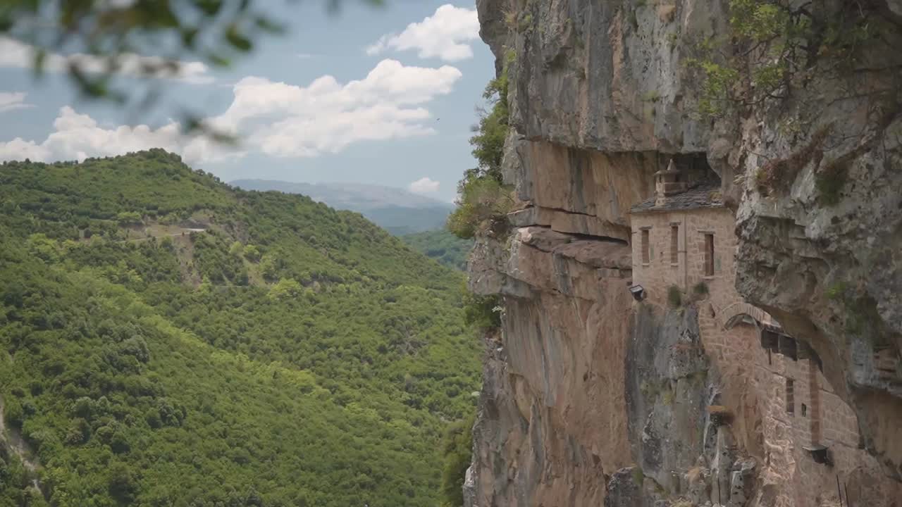 Holy Kipinas Monastery landmark and hiding place during occupation built into the cliff around Tzoumerka, Greece