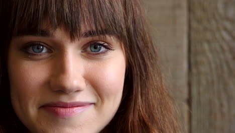 closeup face of smiling volunteer worker with blue