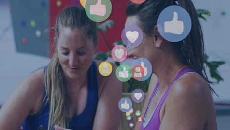 animation of social media icons over sportswomen with smartphone