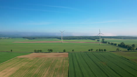 drone view above wind turbine farm in netherlands, alternative energy