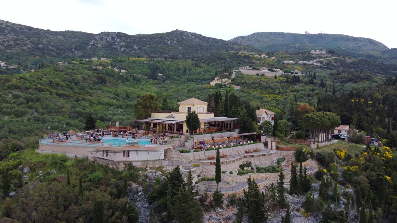 Fly around a Restaurant, Cocktail Bar and pool in Drymonas green hillside, Lefkada