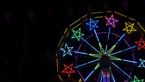 colorful ferris wheel neon lights at night at a carnival