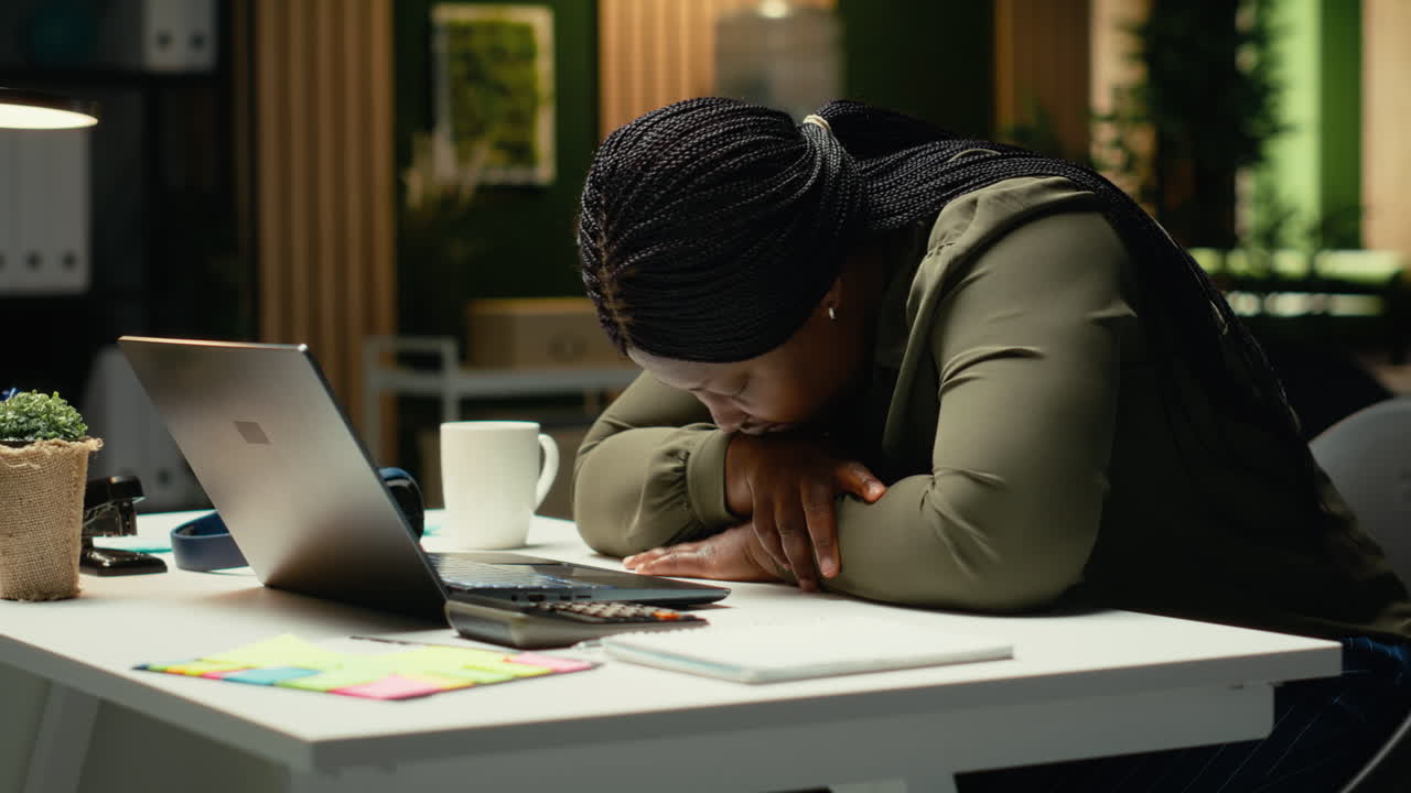 African american drained woman experiencing weariness after hours at desk