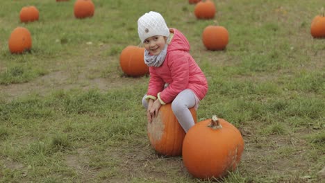 playful child having fun in autumnal garden