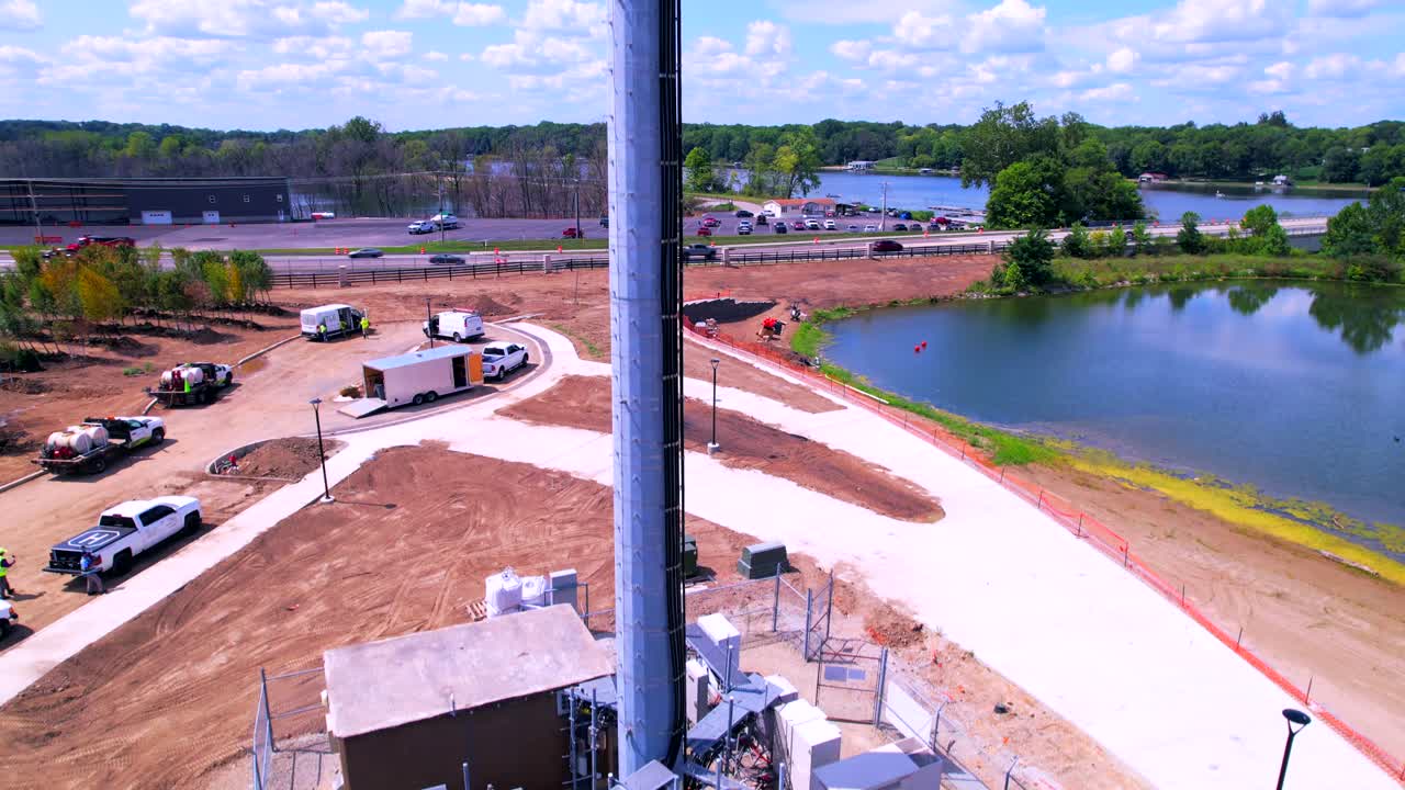 Cell tower on riverbanks and panoramic view