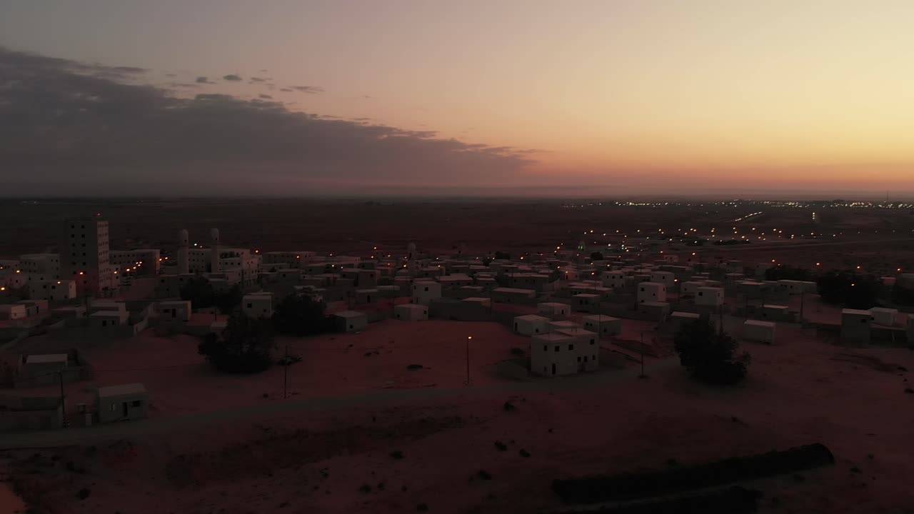 aerial view of the orange beautiful sunrise at abandoned arabic city near gaza in palestine