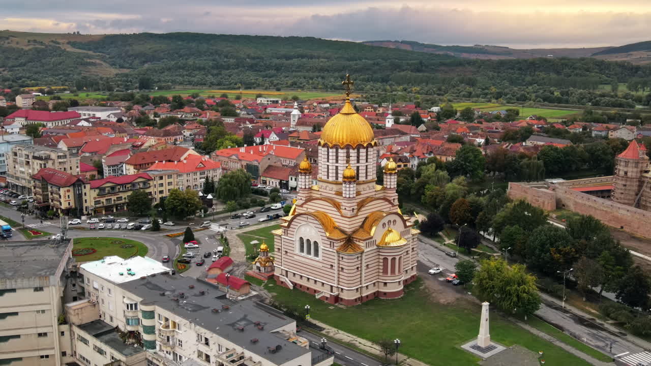 Aerial drone view of the Fagaras, Romania. Church of the Saint John the Baptist and Fagaras Citadel, multiple buildings, roads
