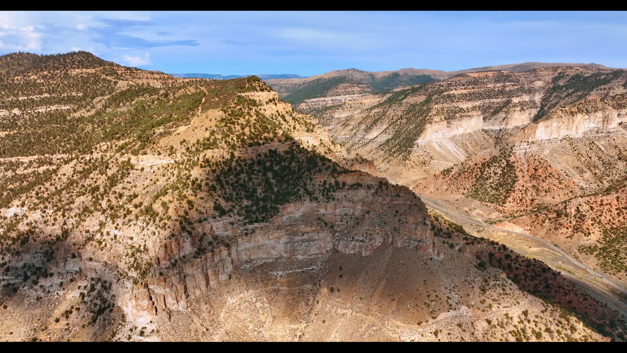 Majestic mountains covered with lichens. Dry barren rocky scenery of Price Canyons in Utah, USA. Aerial view