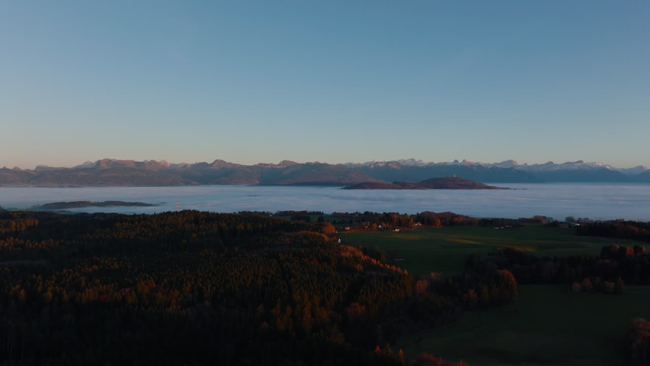 Winter Fog Overcast The Lowlands In Geneva Lake Region With Swiss Alps Visible At Distant In Vaud, Switzerland