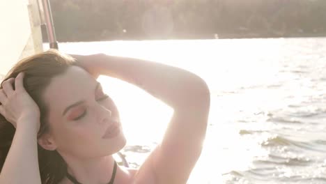 woman relaxing on a yacht at sunset