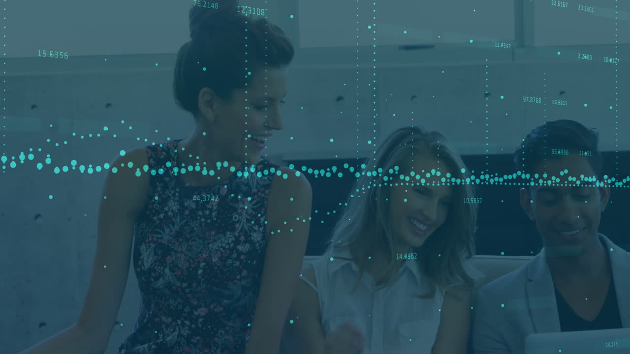 Animation of data processing over diverse colleagues smiling together looking at laptop at office