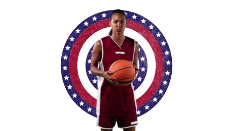 African-american-female-basketball-player-holding-a-ball-against-against-stars-on-spinning-circles